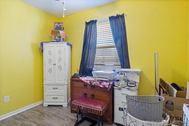 home office with hardwood / wood-style flooring