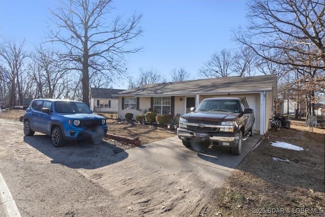 ranch-style house featuring a garage