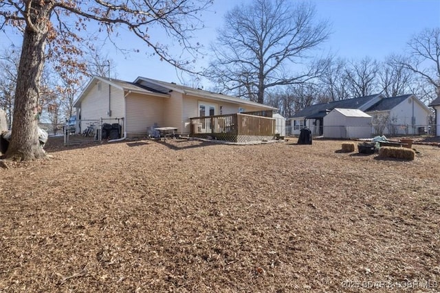 back of house featuring a deck