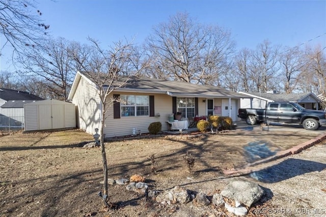 view of front of house with a shed and covered porch