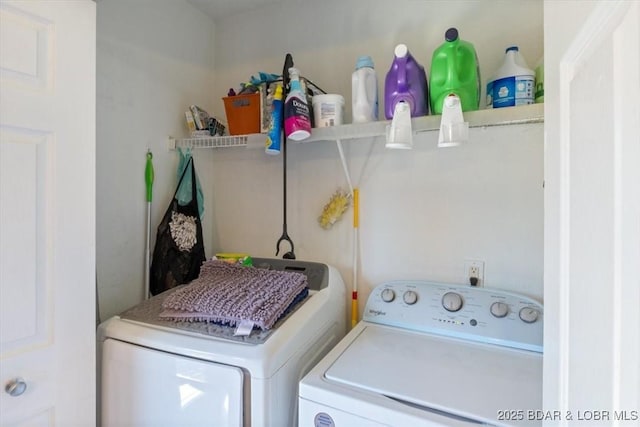 clothes washing area with washer and clothes dryer