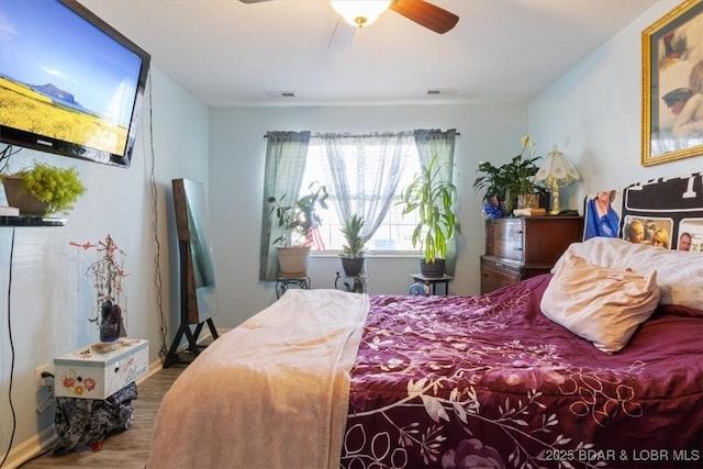 bedroom featuring ceiling fan and hardwood / wood-style floors