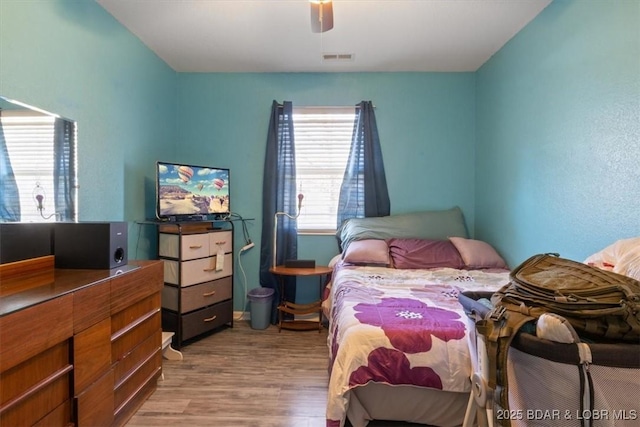 bedroom featuring ceiling fan and light hardwood / wood-style flooring