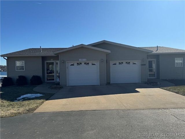 ranch-style house featuring a garage