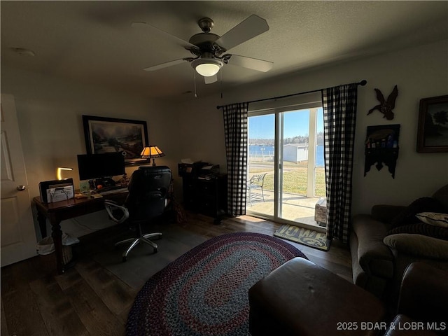 home office with hardwood / wood-style floors, a textured ceiling, and ceiling fan