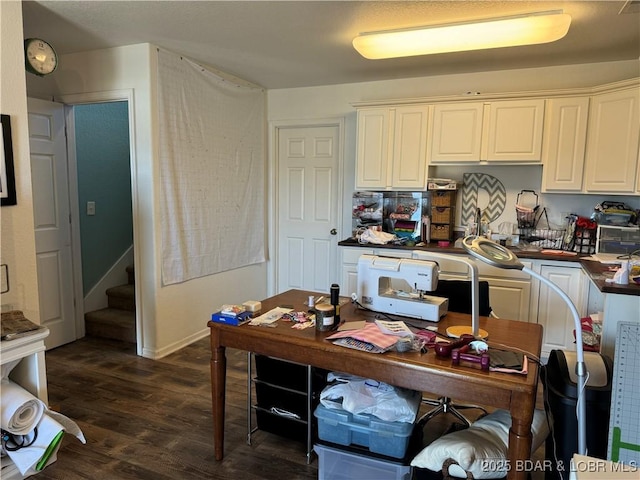 kitchen with white cabinetry and dark hardwood / wood-style flooring