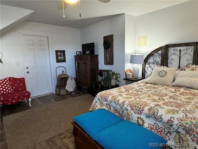 bedroom with dark wood-type flooring and ceiling fan