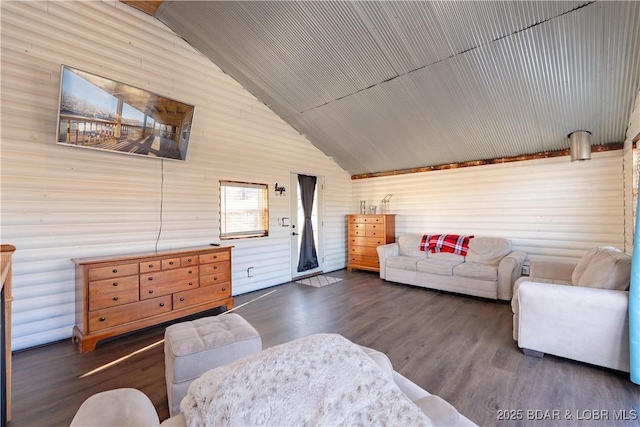 living room with dark wood-type flooring and high vaulted ceiling