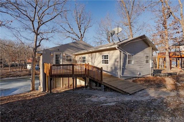 back of property featuring a deck