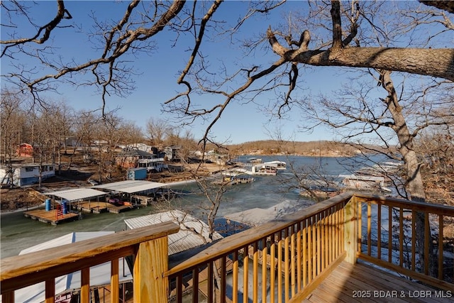 wooden terrace featuring a water view