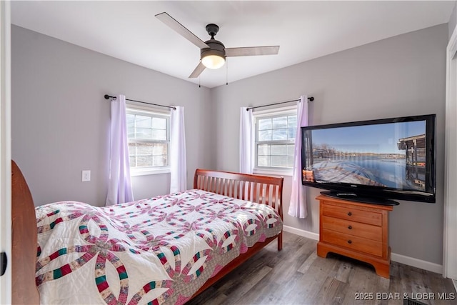 bedroom featuring dark wood-type flooring and ceiling fan