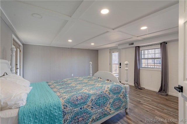 bedroom with hardwood / wood-style flooring, coffered ceiling, and access to exterior