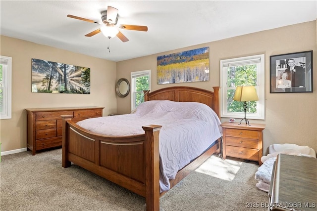 bedroom with light colored carpet and ceiling fan