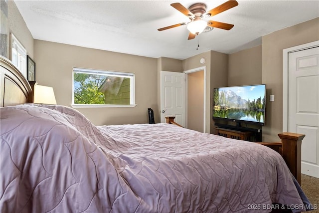 bedroom with ceiling fan and carpet flooring