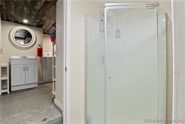 bathroom featuring vanity and an enclosed shower