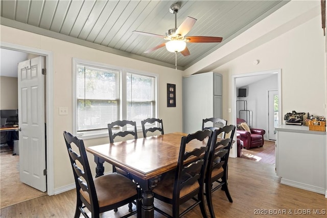 dining space featuring wood ceiling, ceiling fan, lofted ceiling, and light hardwood / wood-style flooring