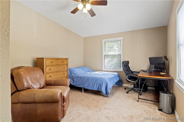 carpeted bedroom with lofted ceiling and ceiling fan