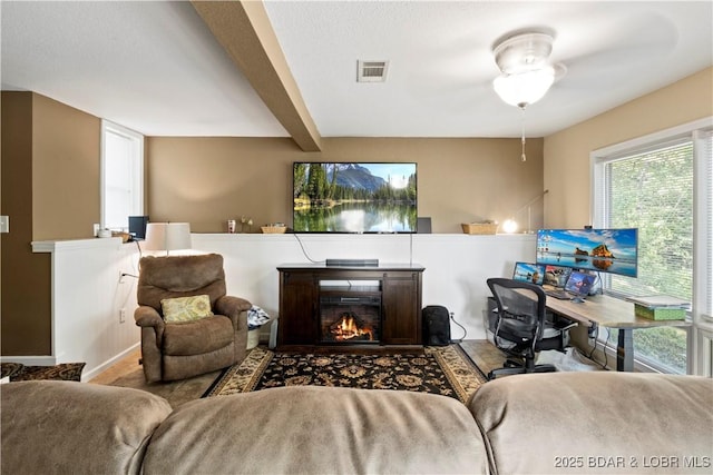 living room with beamed ceiling