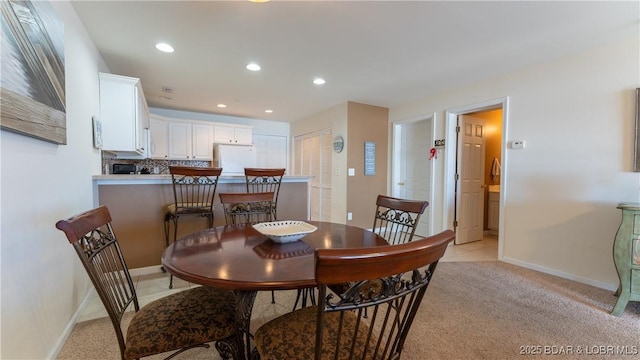 view of carpeted dining space