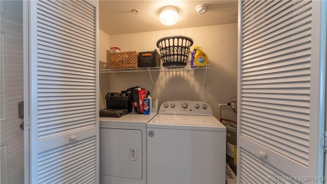 clothes washing area featuring washer and clothes dryer