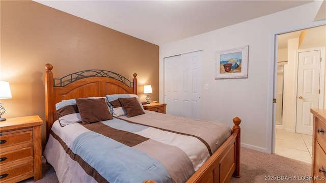 bedroom with light carpet and a closet