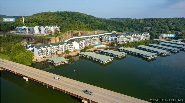 birds eye view of property with a water view