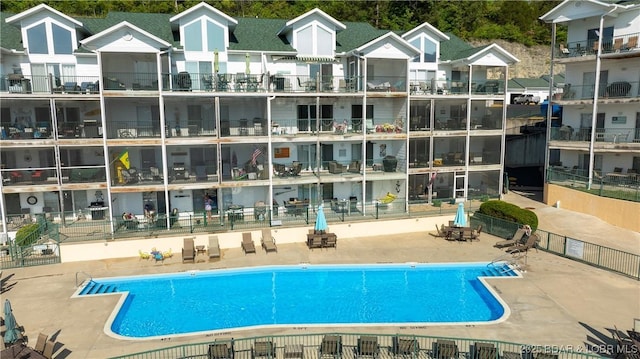 view of swimming pool featuring a patio area