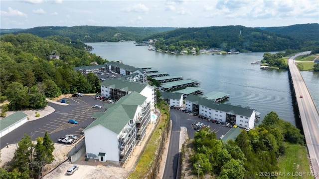 birds eye view of property with a water view