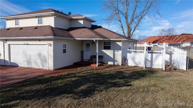 exterior space with a garage and a yard