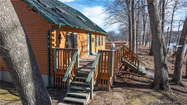 view of playground featuring a deck and stairway