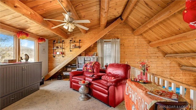 living area featuring vaulted ceiling with beams, wood walls, carpet flooring, wood ceiling, and a ceiling fan