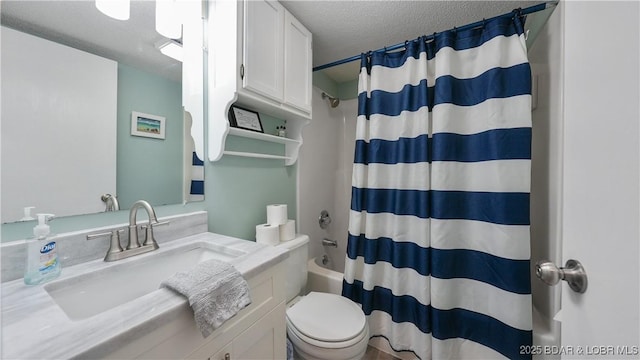 full bathroom with shower / bathtub combination with curtain, vanity, toilet, and a textured ceiling