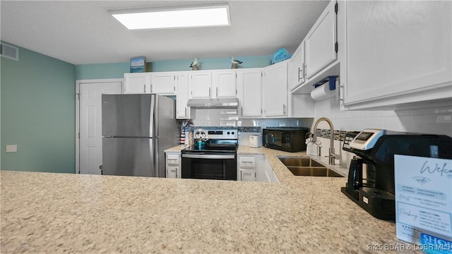 kitchen with backsplash, appliances with stainless steel finishes, sink, and white cabinets