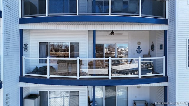 view of home's exterior featuring a balcony and ceiling fan