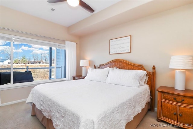 bedroom with light colored carpet and ceiling fan