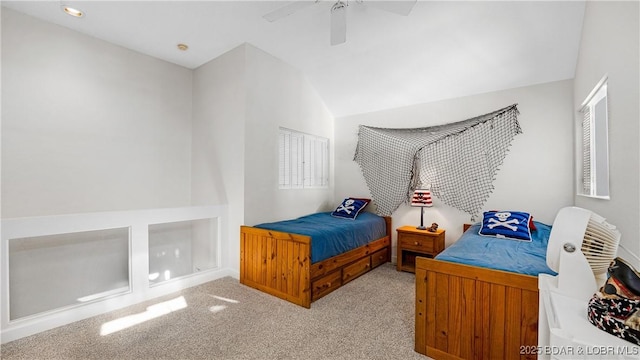 bedroom with vaulted ceiling, light carpet, and ceiling fan