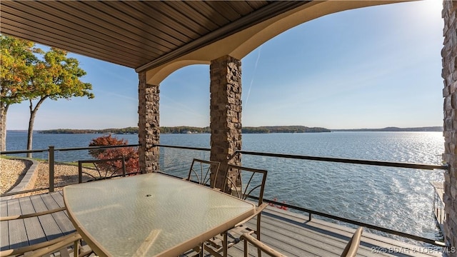 exterior space featuring a water view and a balcony