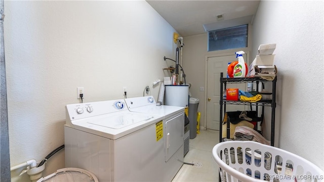 washroom featuring washing machine and clothes dryer