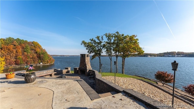 view of patio with a water view