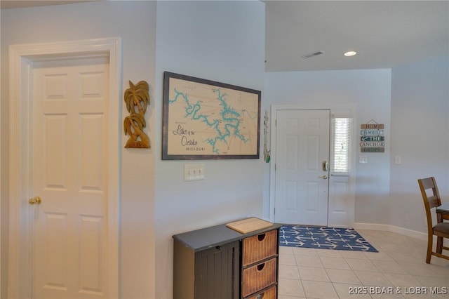 foyer with light tile patterned floors