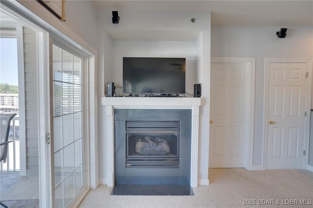 unfurnished living room featuring carpet flooring