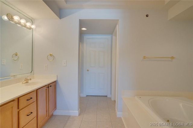 bathroom featuring tile patterned flooring, vanity, and a bathtub