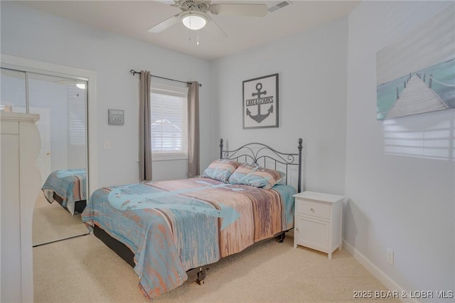 bedroom with light carpet and ceiling fan