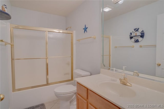 full bathroom featuring toilet, vanity, shower / bath combination with glass door, and tile patterned flooring