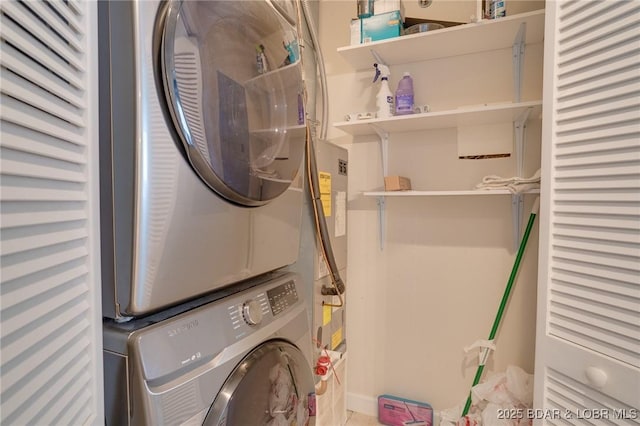 laundry area with stacked washing maching and dryer