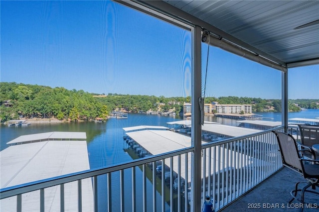 exterior space with a water view and a balcony