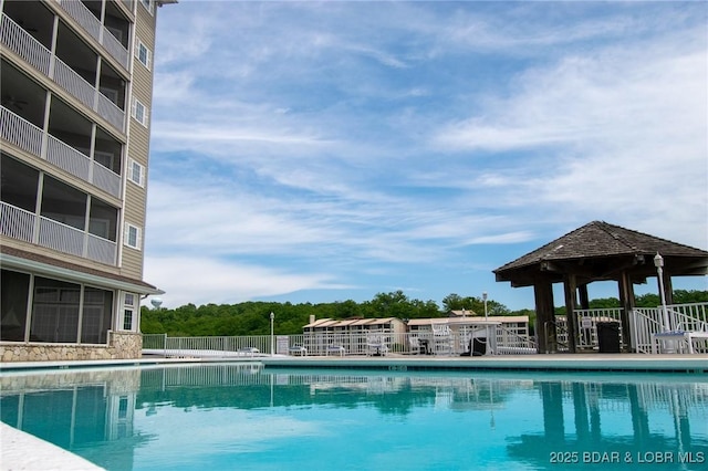 view of swimming pool featuring a gazebo