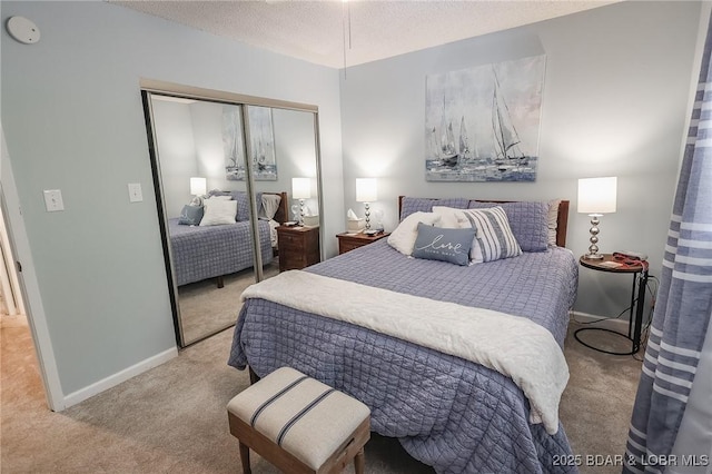 bedroom with light carpet, a textured ceiling, and a closet