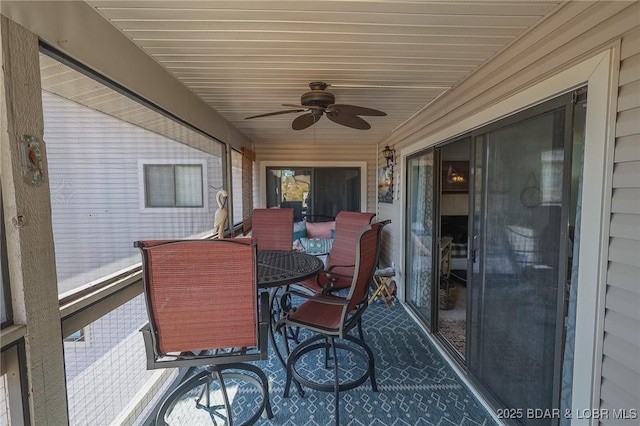 sunroom / solarium with ceiling fan