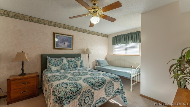 carpeted bedroom featuring ceiling fan and a textured ceiling